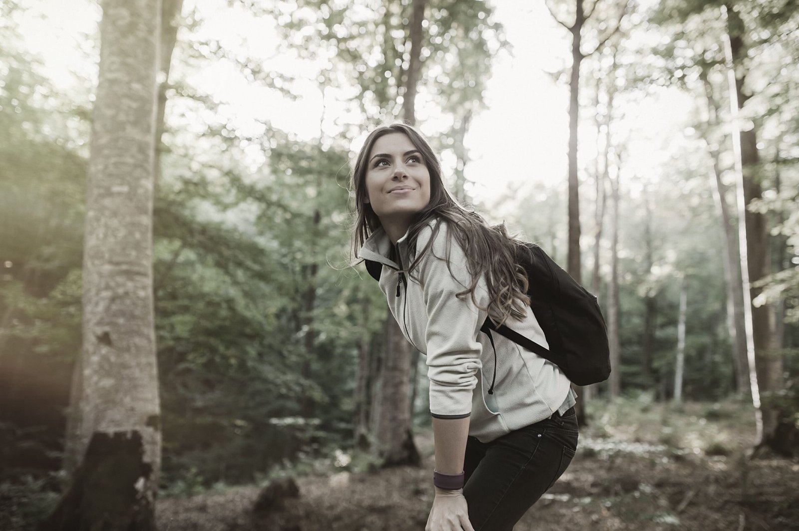 Image-of-woman-walking-in-trail-with-trees-around-near-YT-on-Fourth-new-development-in-milton-scaled